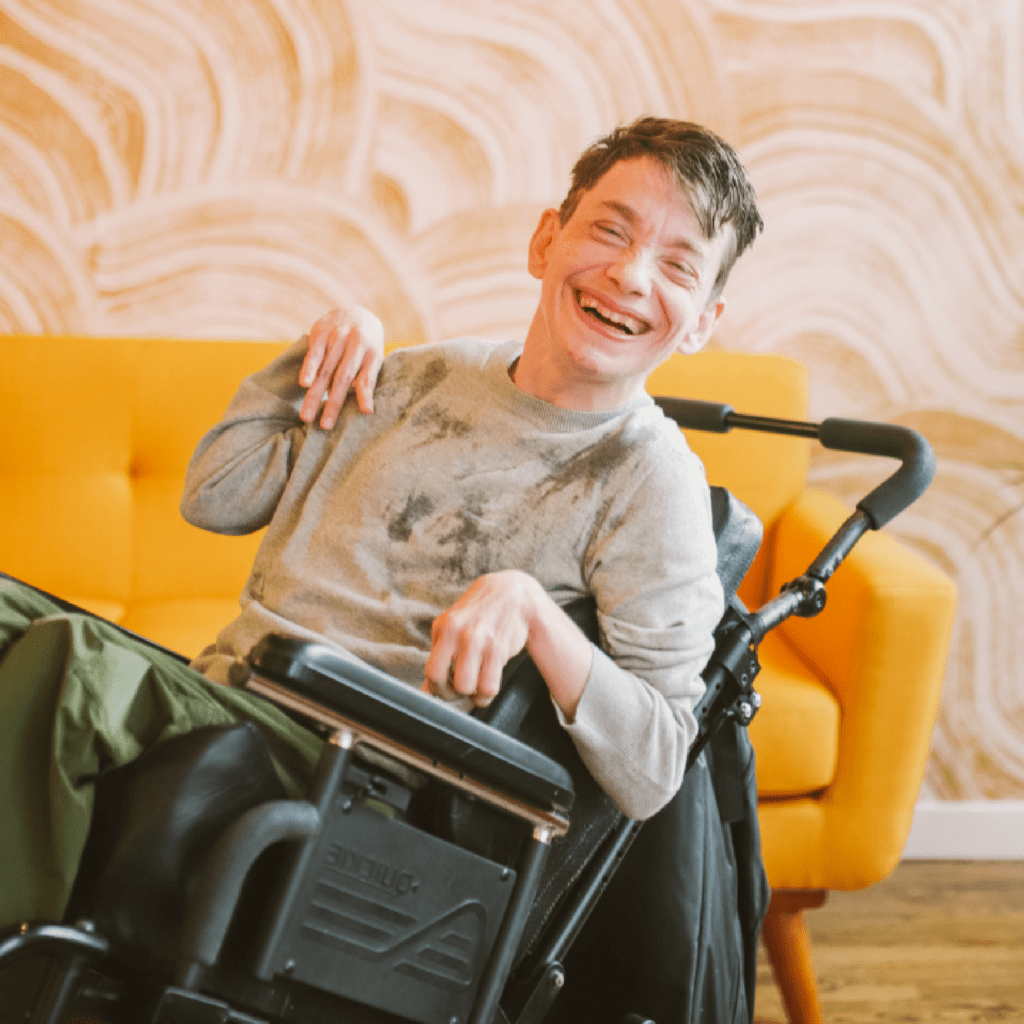 A man with cerebral palsy receiving compassionate and tailored home care services to promote independence